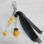 Sleutelhanger lieveheersbeestje geel/zwart Sleutelhanger lieveheersbeestje geel/zwart