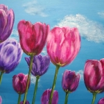 Colored tulips in the blue sky Colored tulips in the blue sky