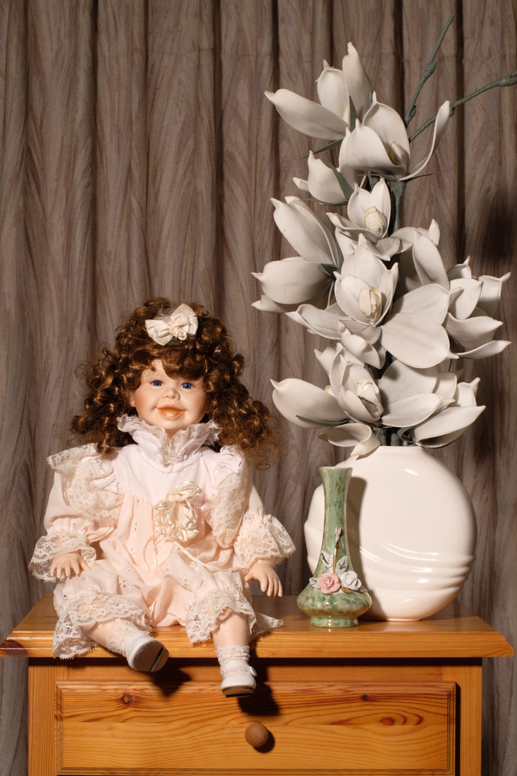 Still life with sitting doll