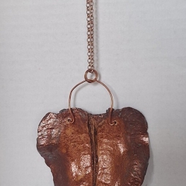 Halssieraad met palissander bronskleurig Halssieraad met palissander bronskleurig
