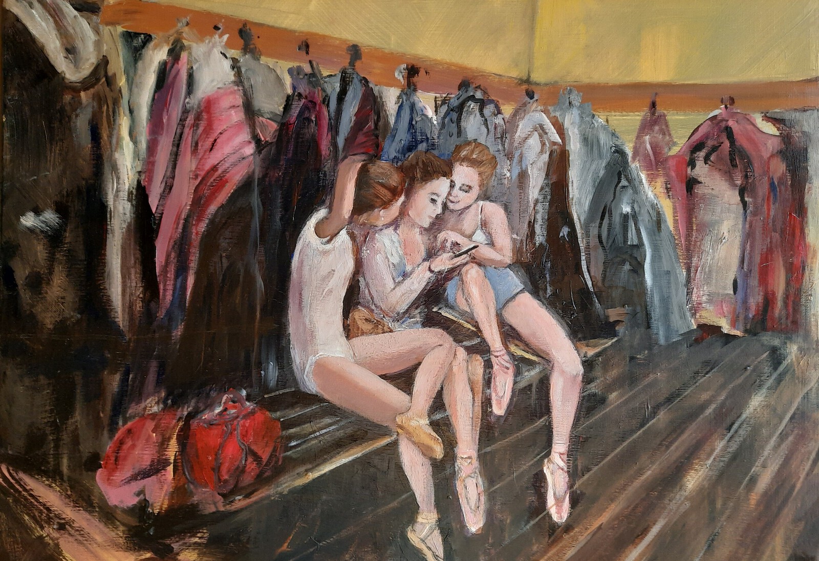 Drie balletmeisjes in de garderobe