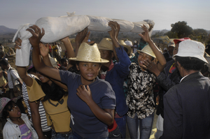 Famadihana is a family tradition to rebury the dead ancestors, unique for Madagascar. Ideally every decade the family is gathering around the ancestral tomb, to enfold whatever is left of the dead in new linen. Although a little solemn, Famadihana is foremost a festivity of food, drinks, dance and music to strengthen family ties. Roanelly family in Faratsiho is keeping up with the tradition.