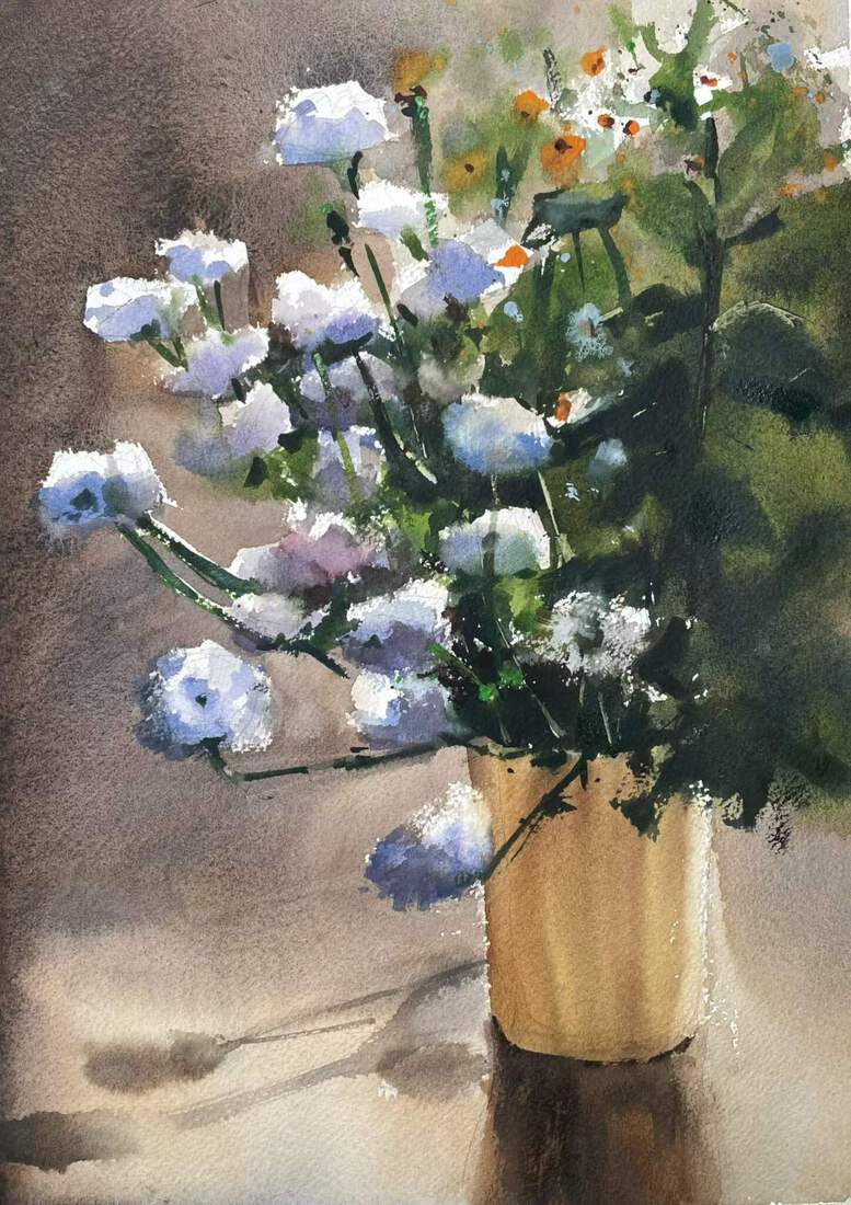 Een emmer vol bloemen