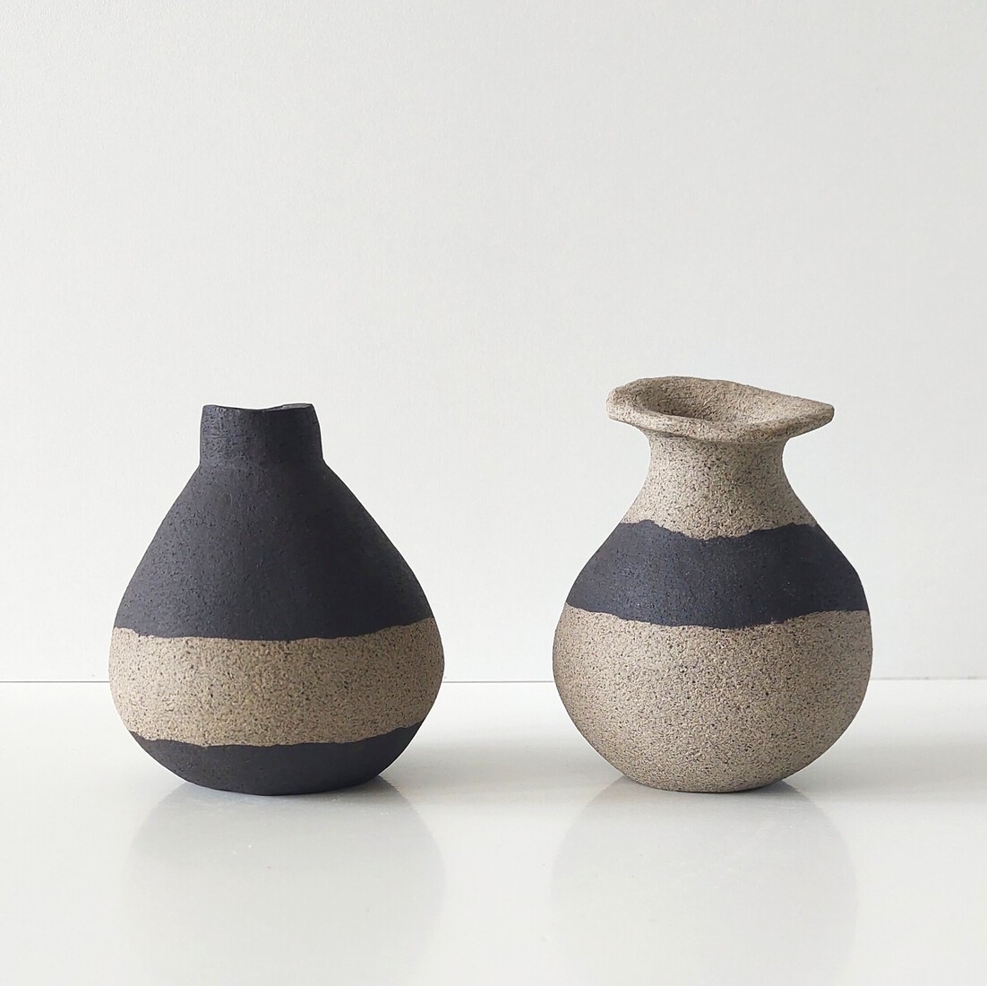 2 vaasjes zand/zwart/zand