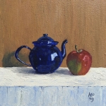 Blue teapot with apple