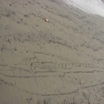 In het zand getekend