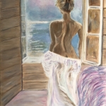 Portret vrouw uitkijkend over zee.