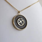 goud- en zilveren hanger geocaching