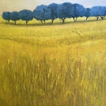 Geel landschap met bomenrij.