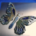 Vlinder met ingelegd glas in vleugel