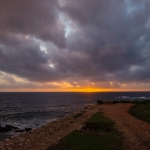 Kust bij zonsondergang