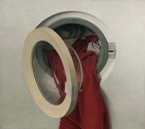 Wasmachine met rode handdoek