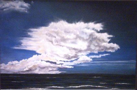 Uitwaaierende wolk boven zee