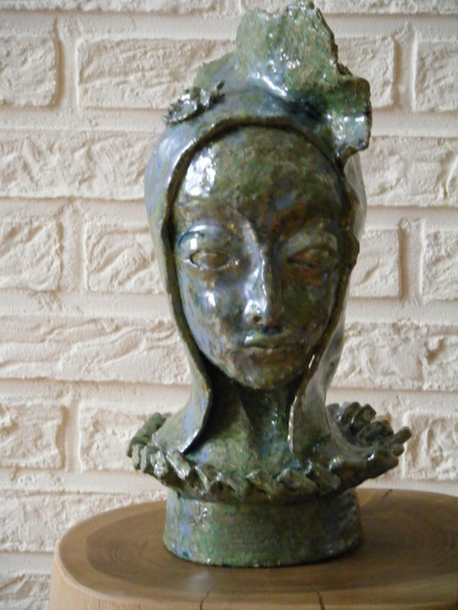 geboetseerd vrouwenkopje