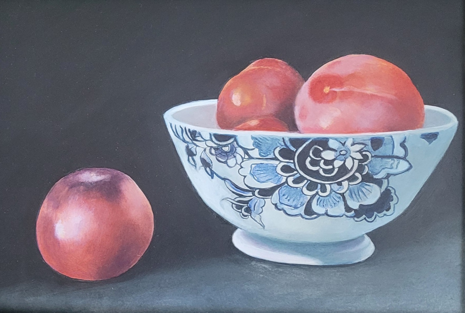 Stilleven nectarines en kom