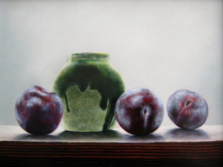 Groen potje met pruimen