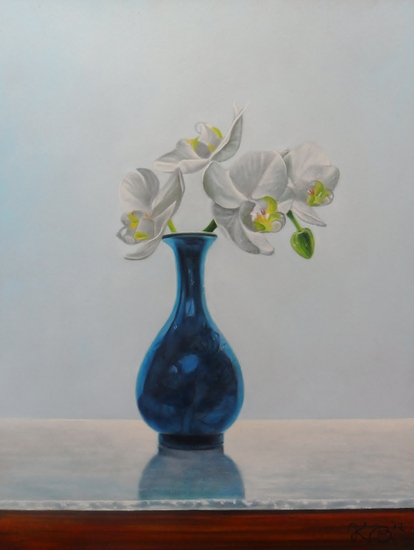 Orchidee op blauw vaasje