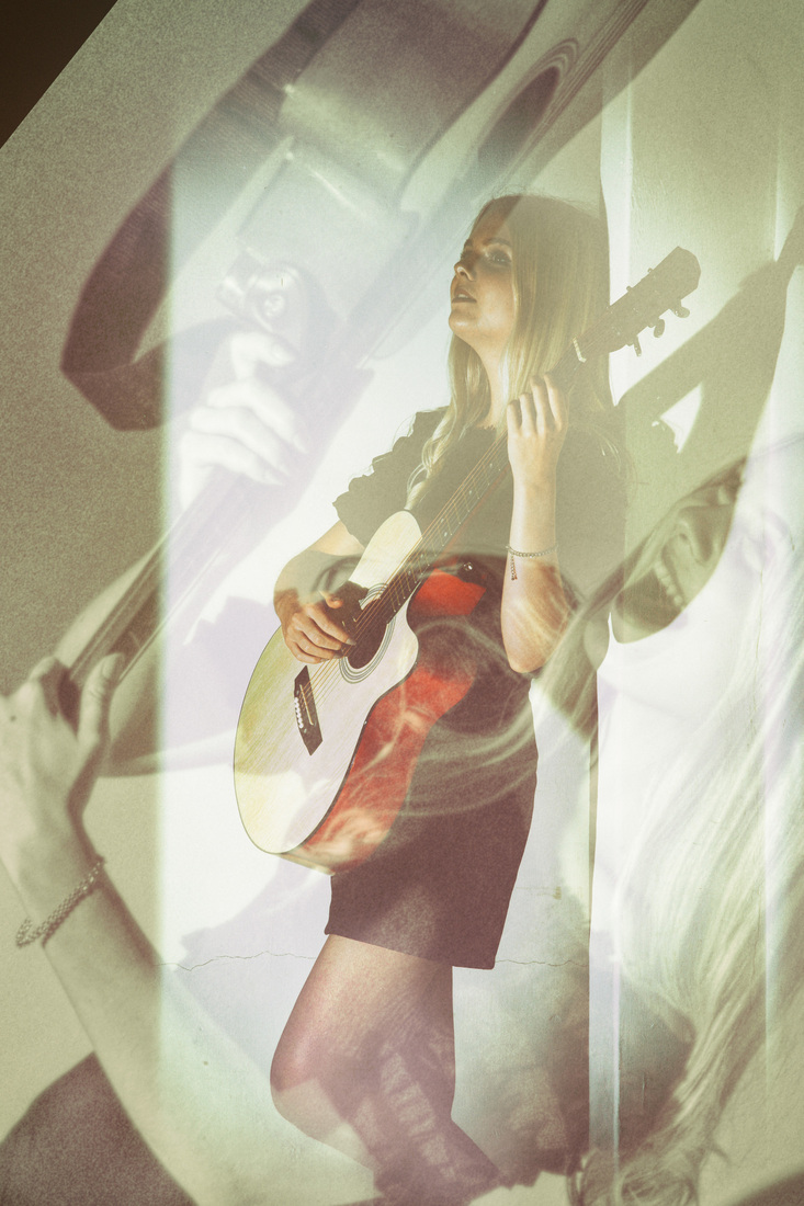 Girl and Guitar. Two Moods 2