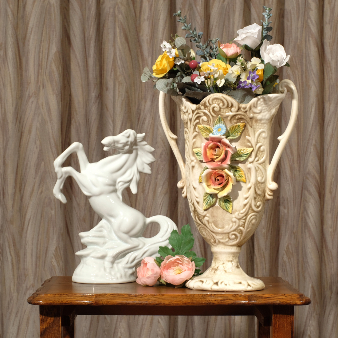 Still life with large vase, horse statue and flowers