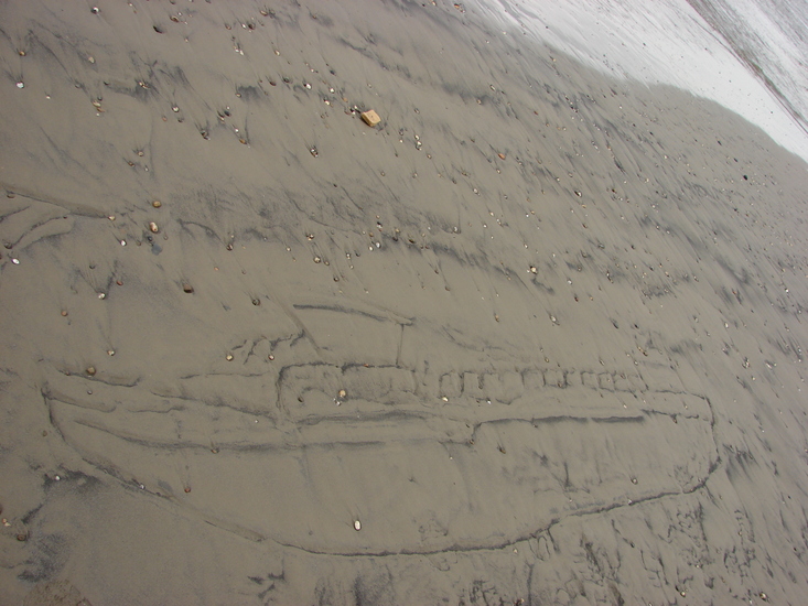 In het zand getekend