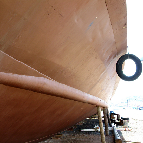 Brown boat with black tyre