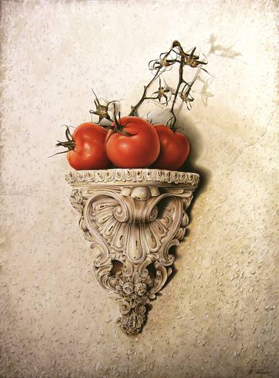 Drie tomaten op console.