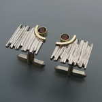 Bicolor gouden manchetknopen met bruine topaas.