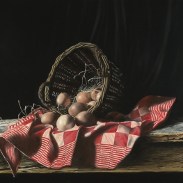 Basket with eggs and red towel
