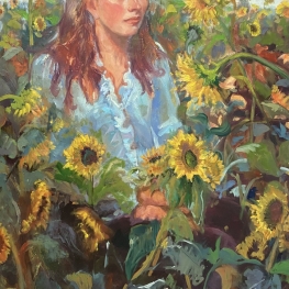 Vrouw tussen de zonnebloemen