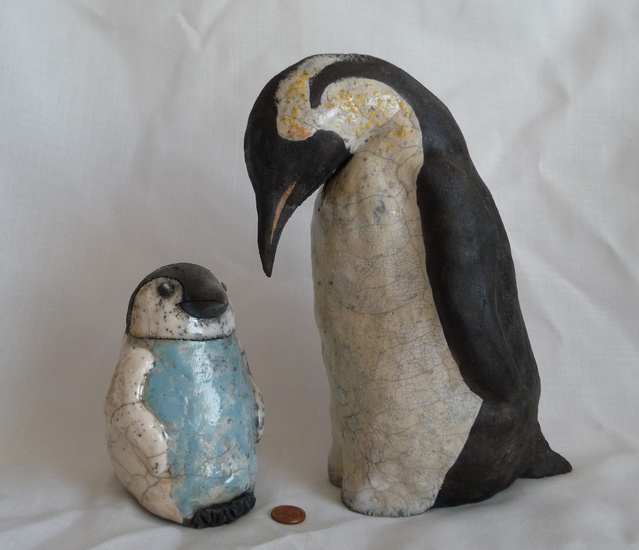 Keizer pinquin met kuiken