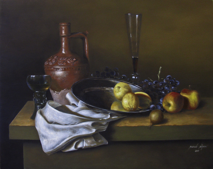 Spanish jar with flute glass and lemons on a silver dish