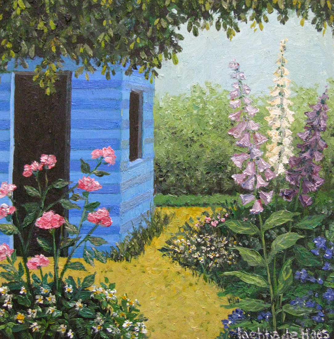 Tuin met blauwe schuur