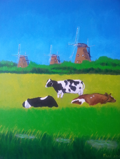 Koeien in weiland met molens