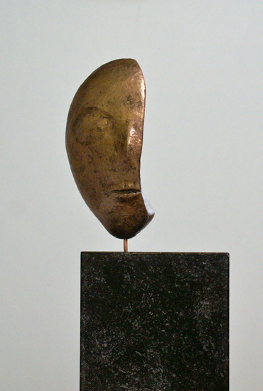 Gehalveerd gouden masker