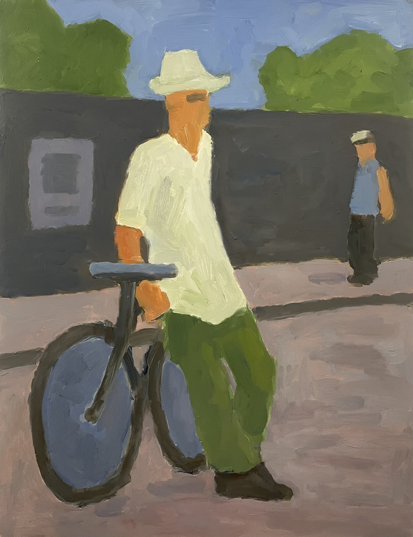 man met hoed en fiets