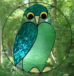 In glas in lood of in tiffany gemaakte raamhangers met dieren.