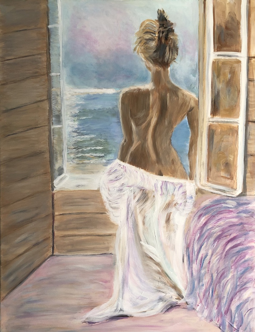 Portret vrouw uitkijkend over zee.