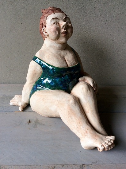 Vrouw in groen badpak