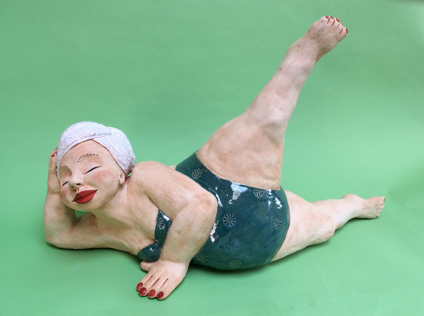 Vrouw in groen badpak