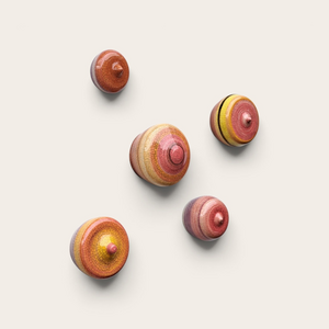 This handmade ceramic wall art piece features soft layered rings in warm colors, finished with a glossy, lightly crackled surface. Its rounded or  sculptural organic shape gives it a tactile and organic feel, making it a beautiful accent for any interior.  

Each piece is crafted by hand in my studio in the Netherlands, so every wall dot is truly one‑of‑a‑kind.  
Ready to hang — perfect for adding a touch of modern artisan design to your home.
