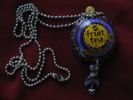 All jewelry is made from bottle caps, tin cans, pop tops from cans mixed with glass and silver beads. Some are on chains and some on black satin cord.