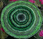 These eco designer rugs are hand crocheted from upcycled plastic bags.