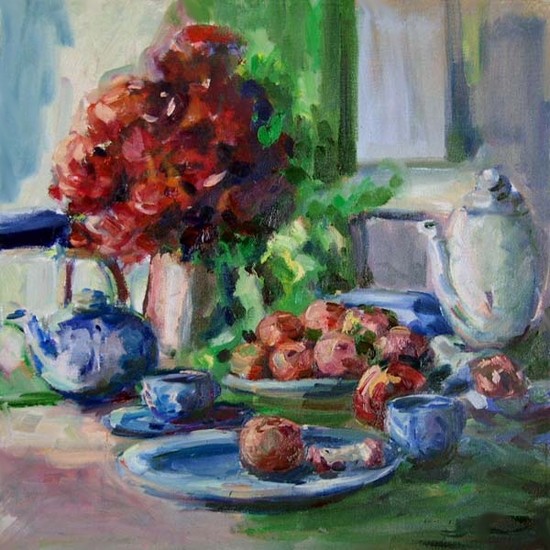 Table with flowers and red apples