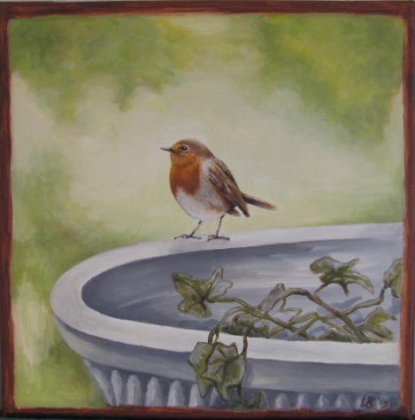 Roodborstje op waterbak