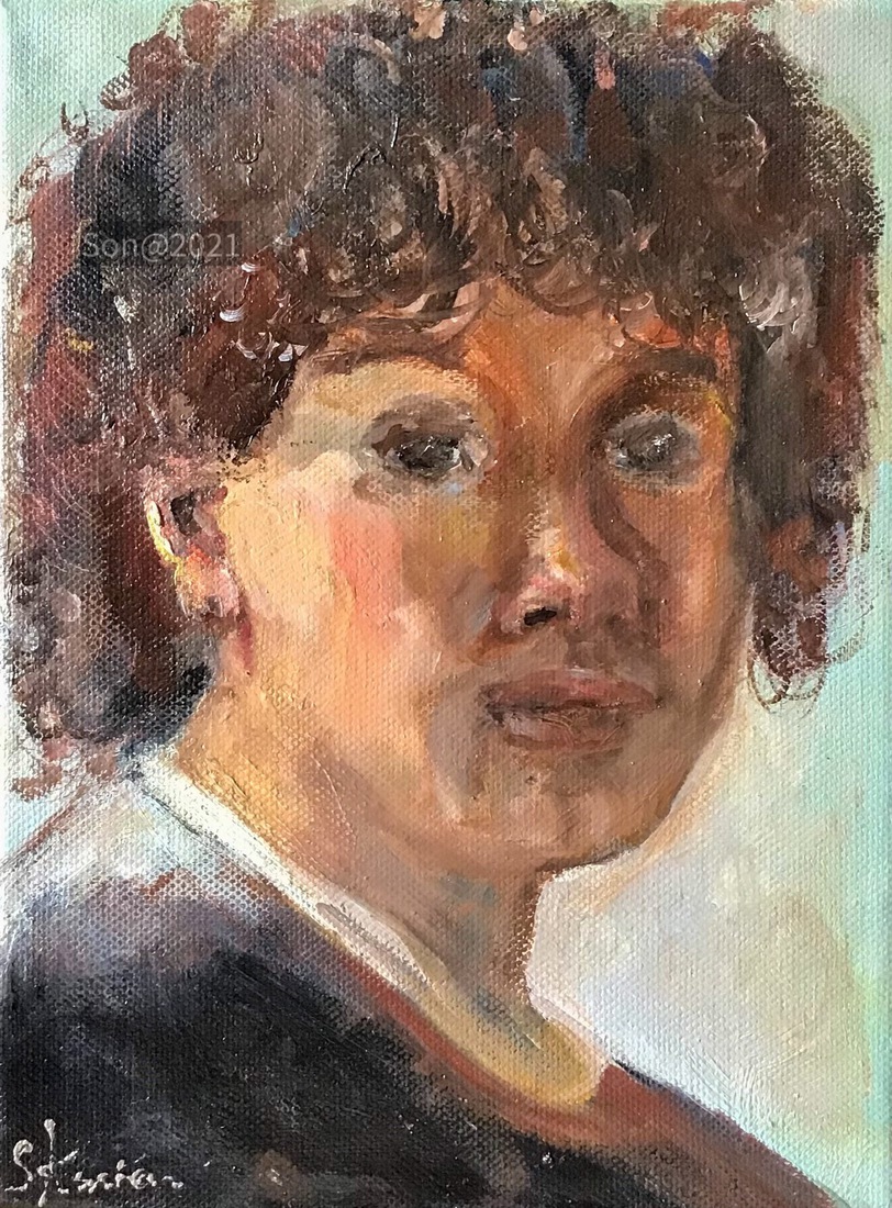 Jongen met bruin krullend haar