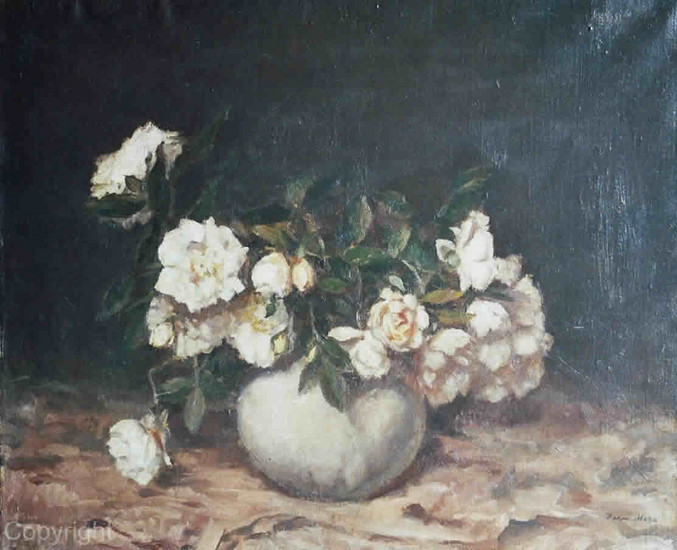 White roses in white vase