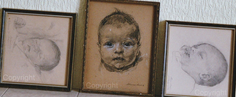 The heads of three babies