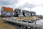 Marken is een voormalig eilandje in het Markermeer dat sinds 1957 via een dijk met het vasteland verbonden is. Al meer dan een eeuw is het voormalige vissersdorp een belangrijke toeristische trekpleister. De opvallende klederdracht heeft daaraan bijgedragen. Karakteristiek zijn de houten huizen op palen.