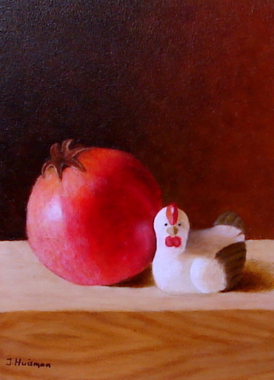 Granaatappel met houten kipje