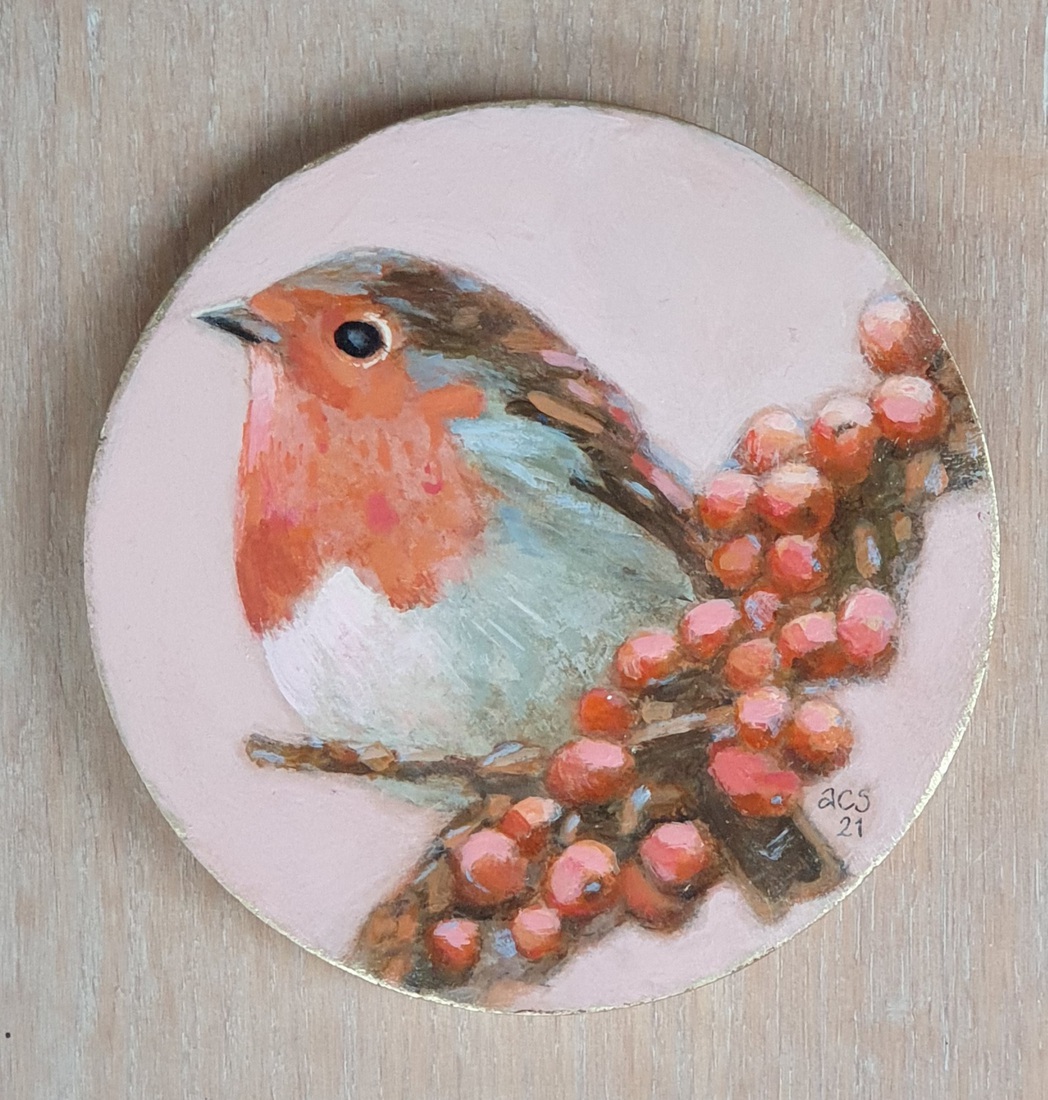 Roodborstje met bessen